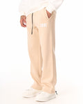 Martin Valen 1881 oversized beige jogger, close-up of waist with black drawcord and white embroidered 1881 logo