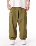 Martin Valen khaki wide-leg trousers with adjustable cuff, front mid-body view showing cargo pockets and side label