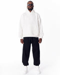 Martin Valen full-length black corded joggers, front view on model showing elasticated cuffs and stitch details