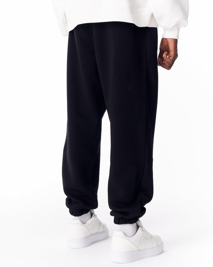 Martin Valen full black corded joggers rear view, mid shot showing center stitch and elastic cuff